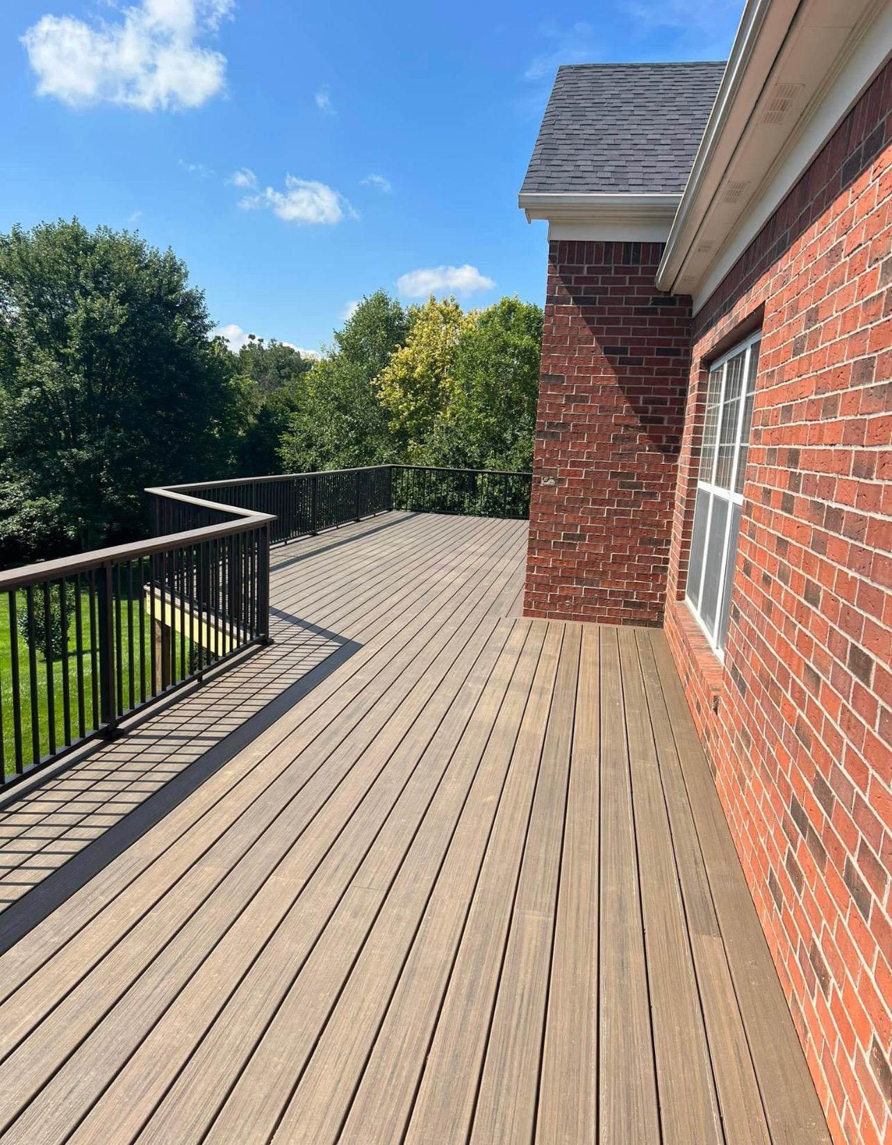 Brick Home Wrap-Around Deck